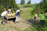 Pouring the tee pad on hole 12.